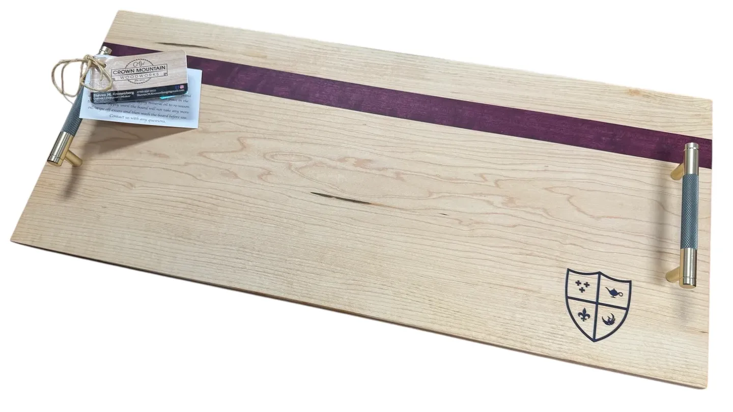 Rectangular wooden tray with metal handles, purple detail, and engraved crest