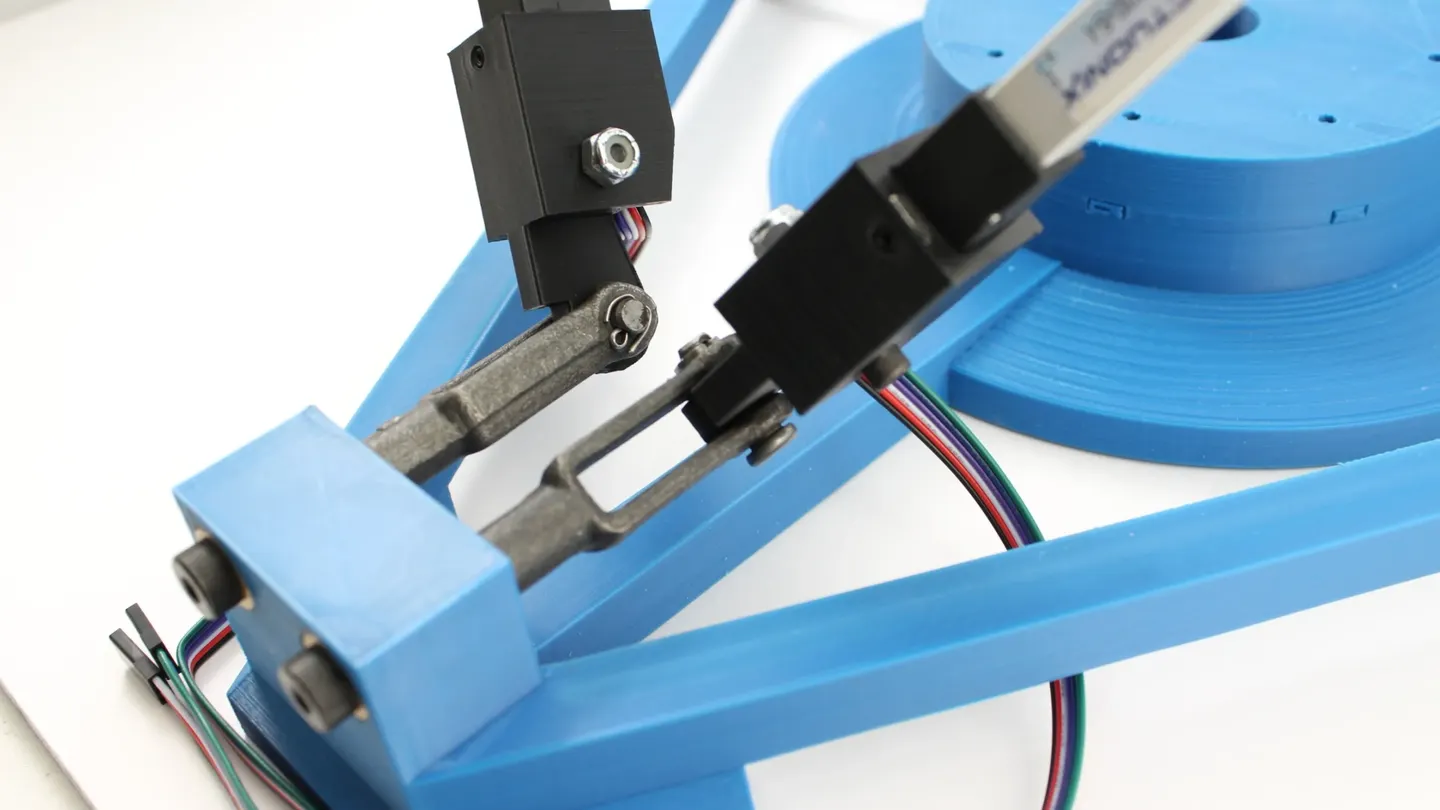 A close-up of a delta-robot joint mechanism