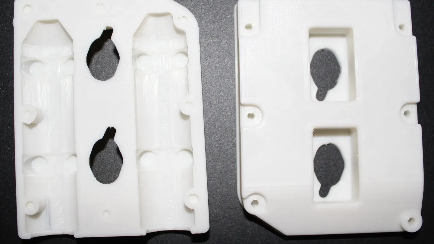 A two-part white enclosure case, 3D-printed and assembled