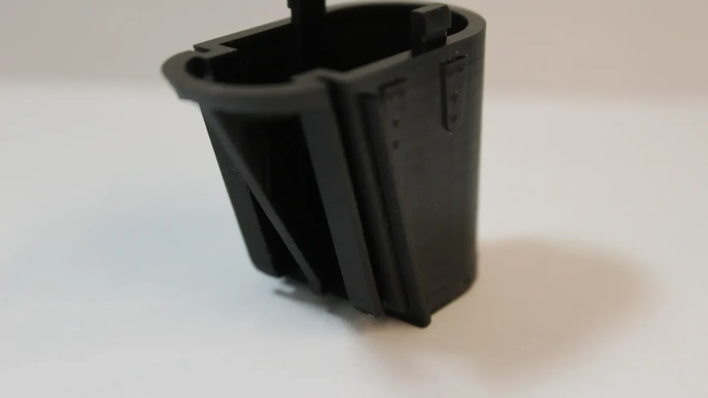 A black enclosure housing part