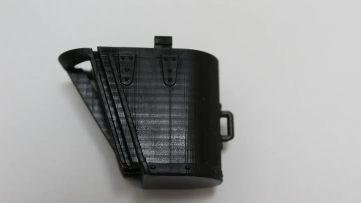 A black enclosure housing part, alternate angle