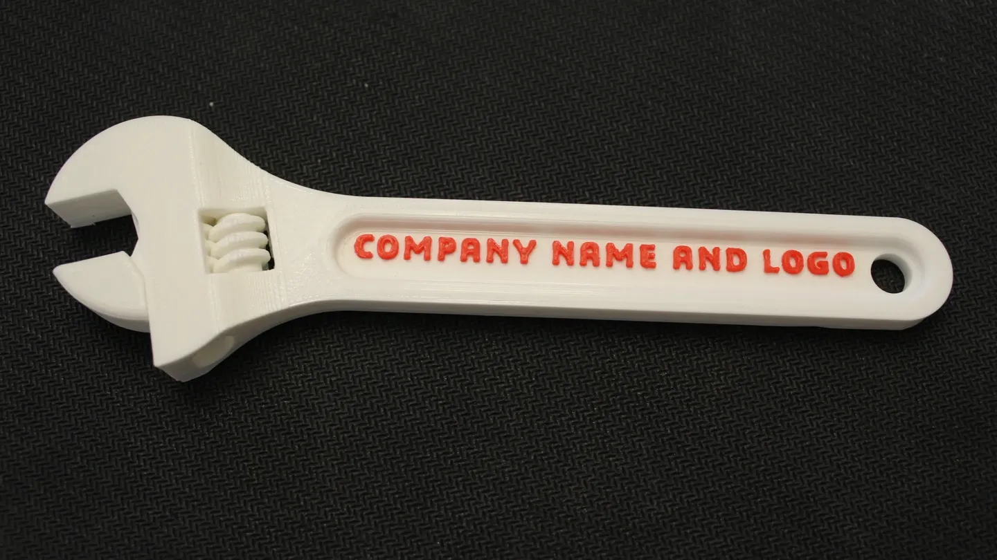 A customizable promotional wrench printed with a company name and logo